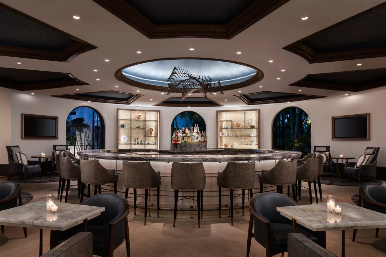 Sophisticated hotel bar with wood and stone details at The Ritz-Carlton Bacara Santa Barbara.