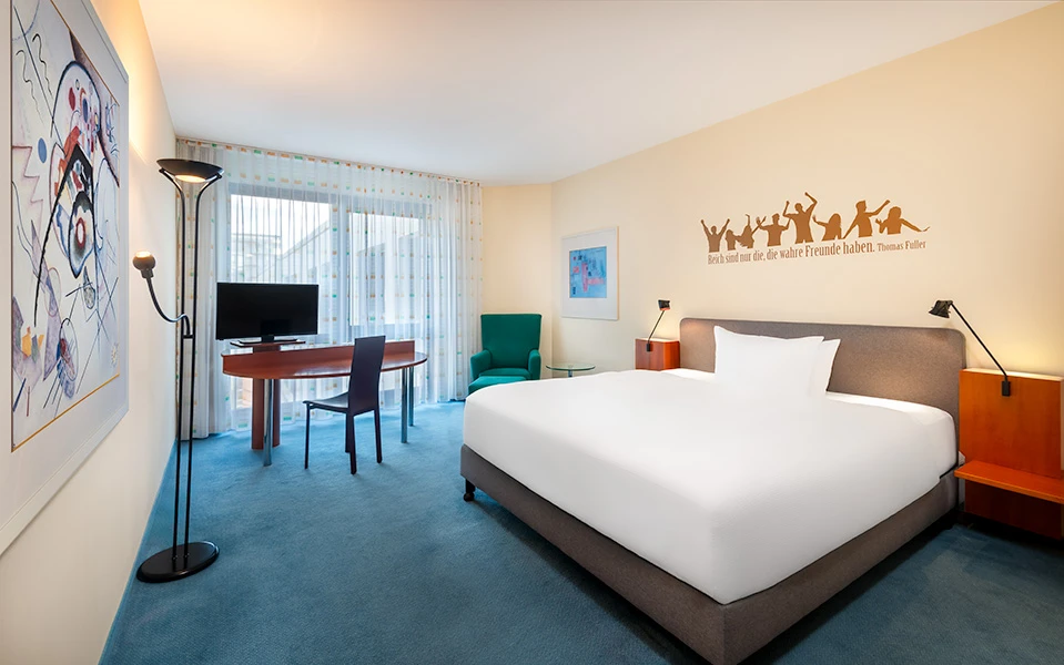 Impeccably made hotel bed with smooth linens and neat arrangement