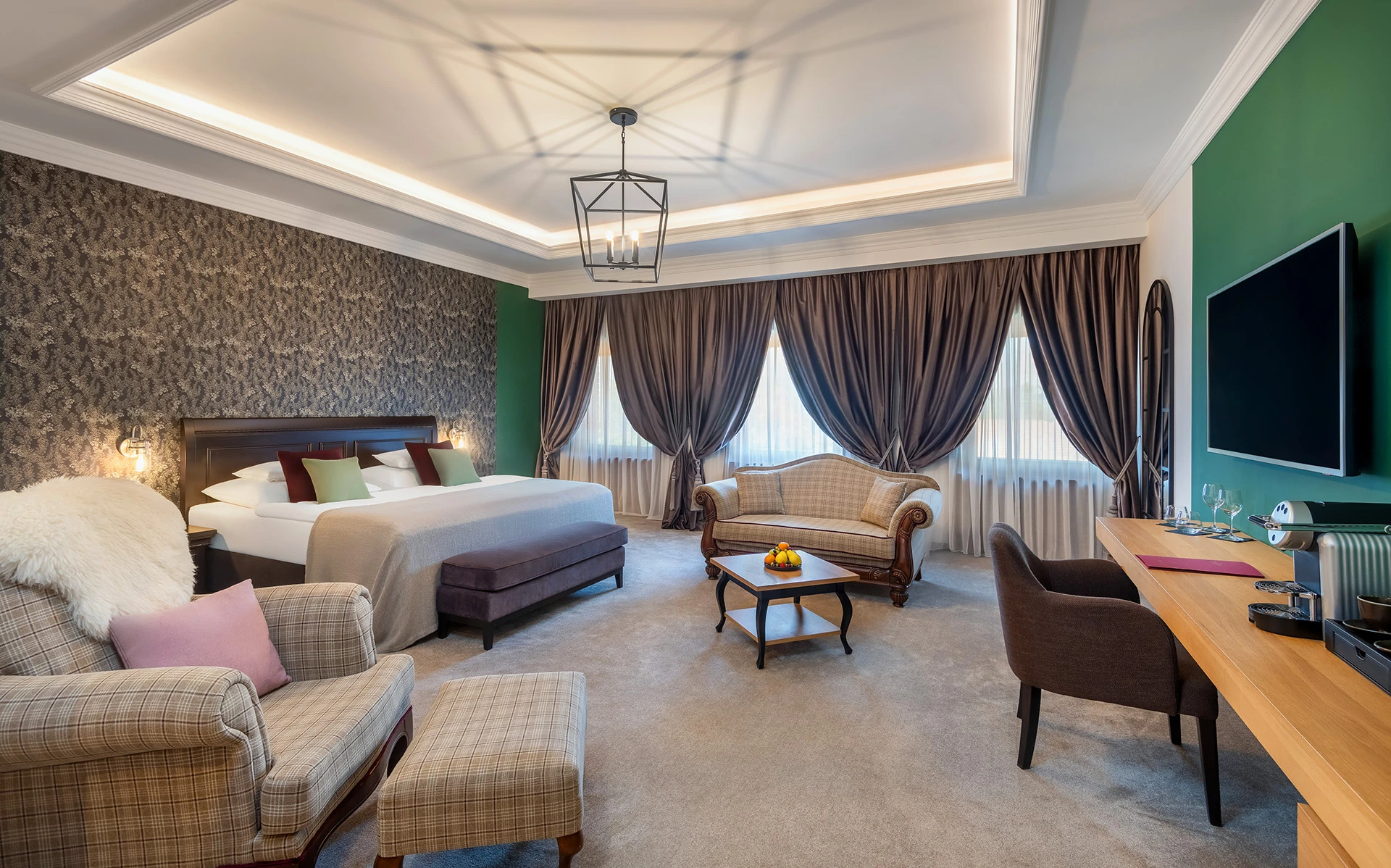 Spacious hotel bedroom with king-size bed and elegant décor