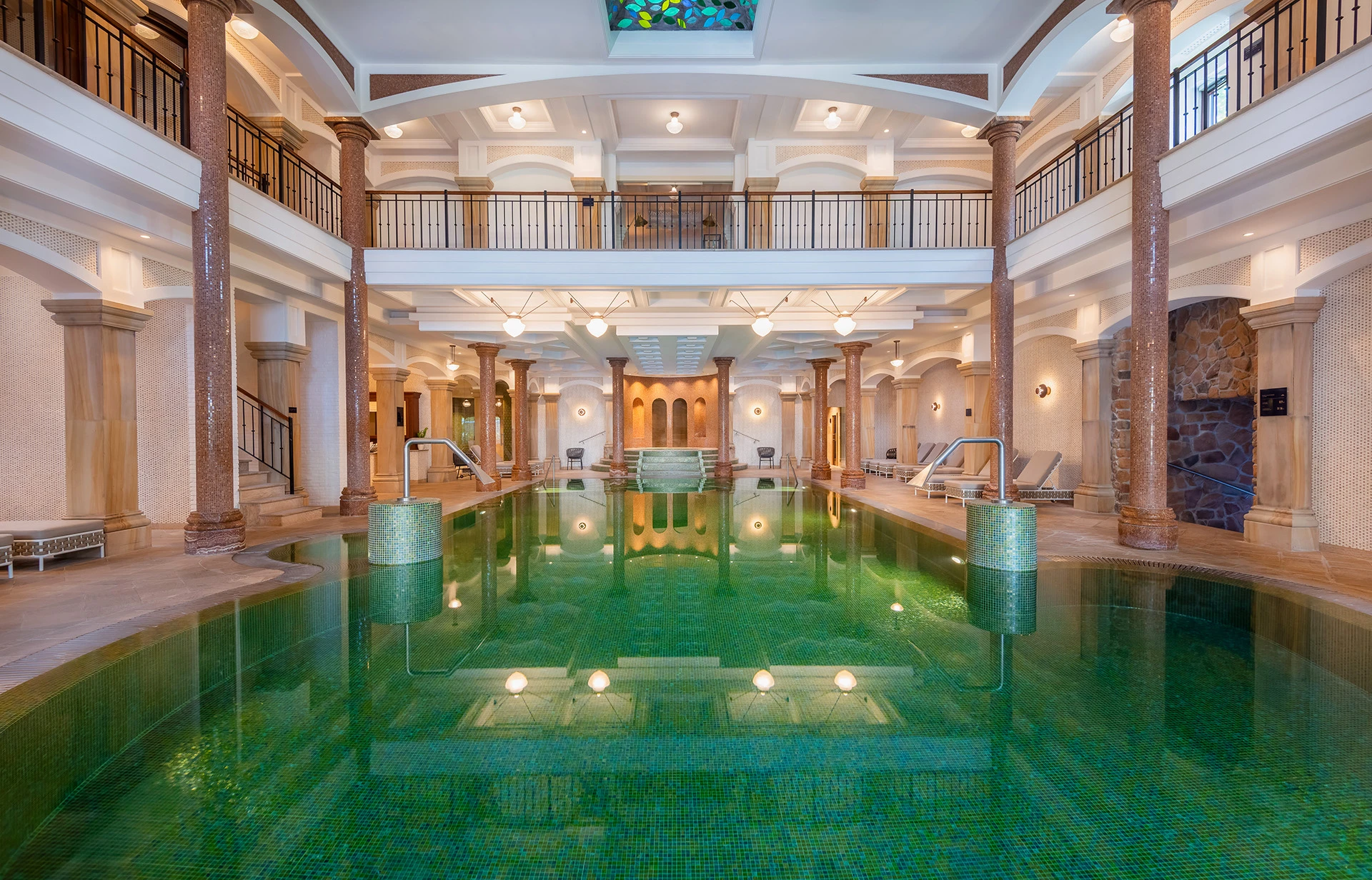 Luxurious indoor spa pool with elegant columns