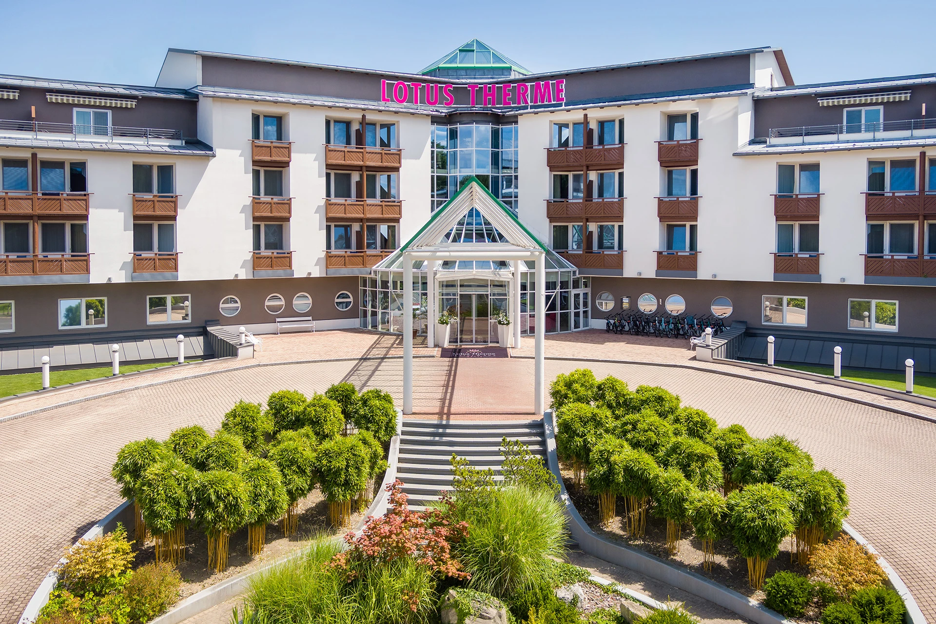 Hotel entrance with glass canopy and modern design