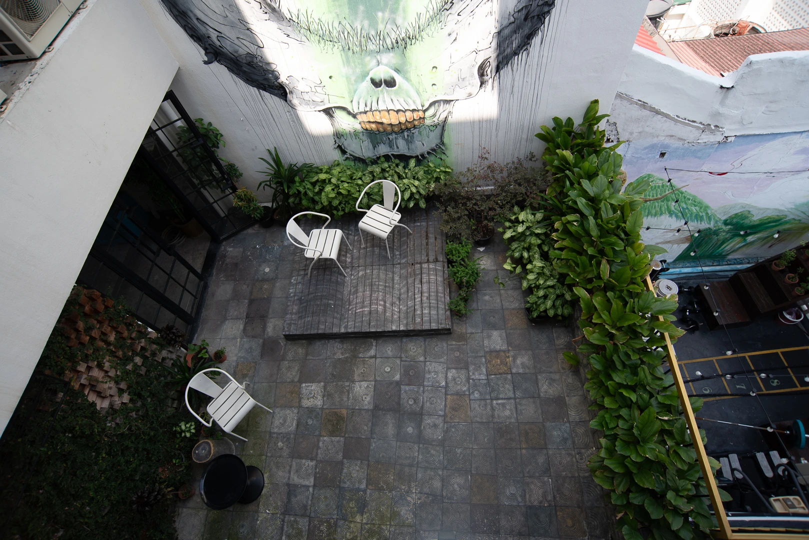 Bad example of outdoor hotel photography – uneven lighting and awkward top-down angle