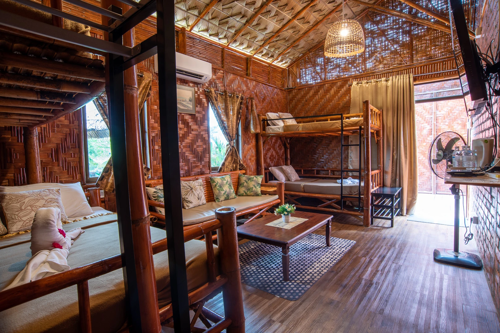 Bad example of hotel photography – cluttered eco-style room with uneven lighting.