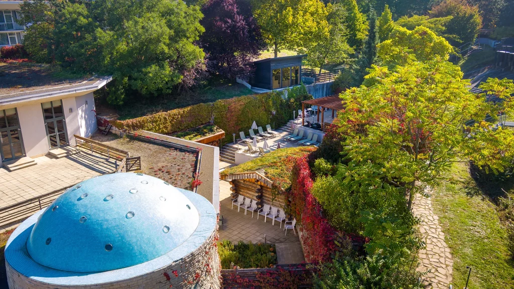 Good example of professional hotel photography – outdoor wellness area surrounded by greenery.
