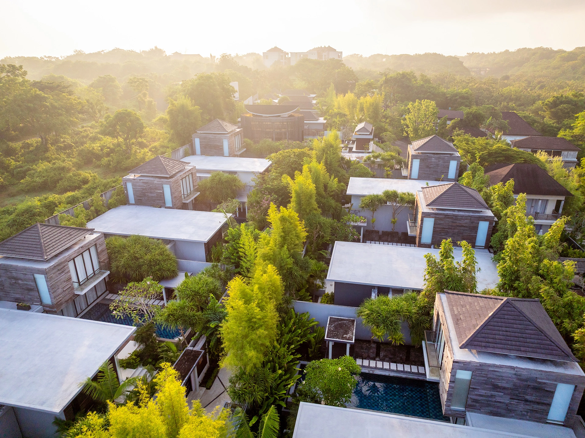 Sunrise aerial view of modern luxury villas in Bali
